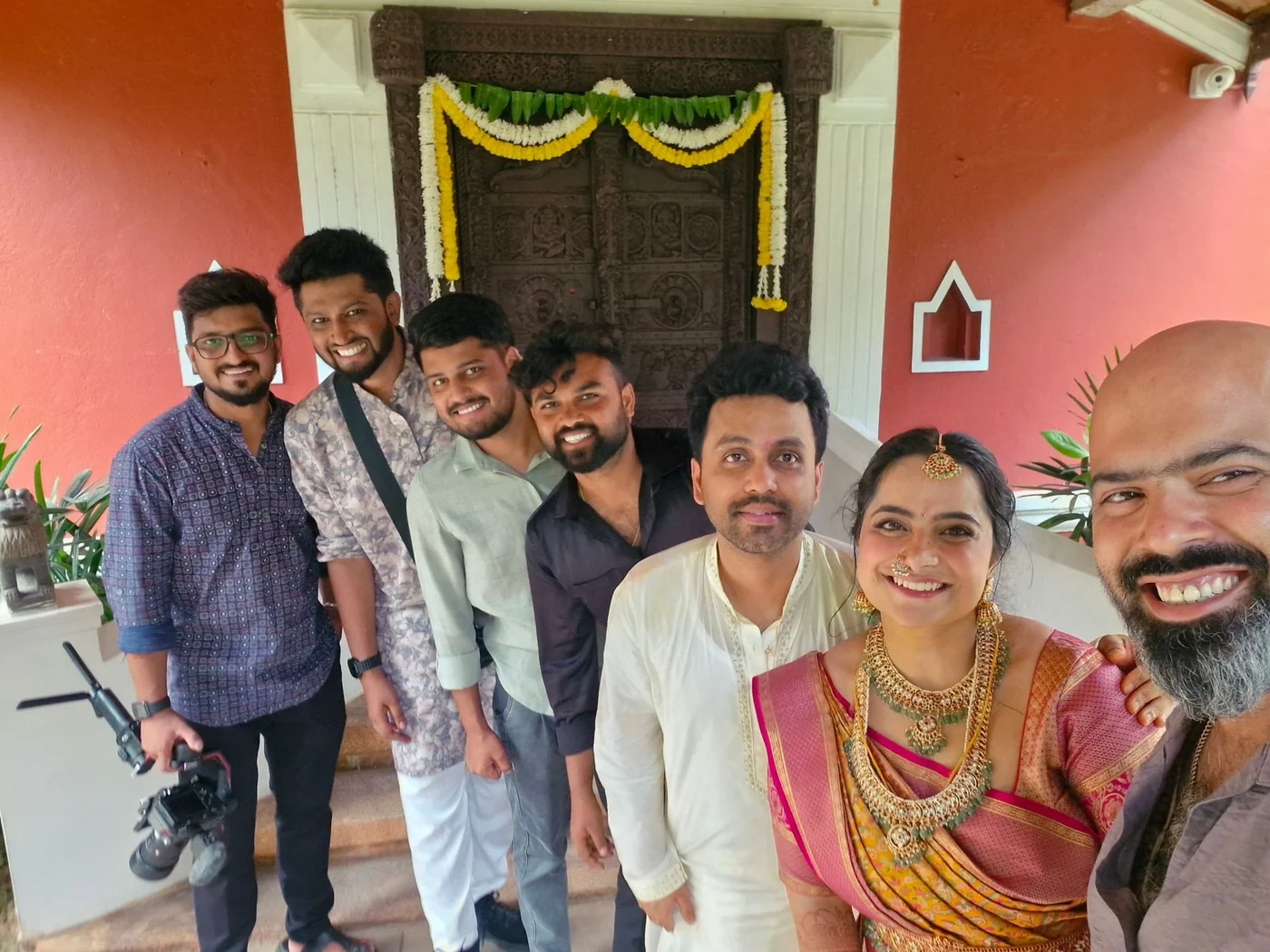 The Nuptial Diaries team with a couple on the morning of their wedding